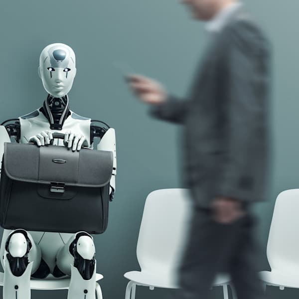 A humanoid AI with a briefcase waiting for a job interview
