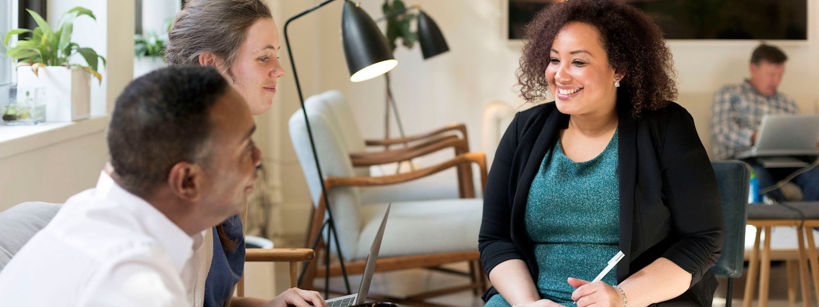 Accountants collaborating, leveraging AI for strategic insights.