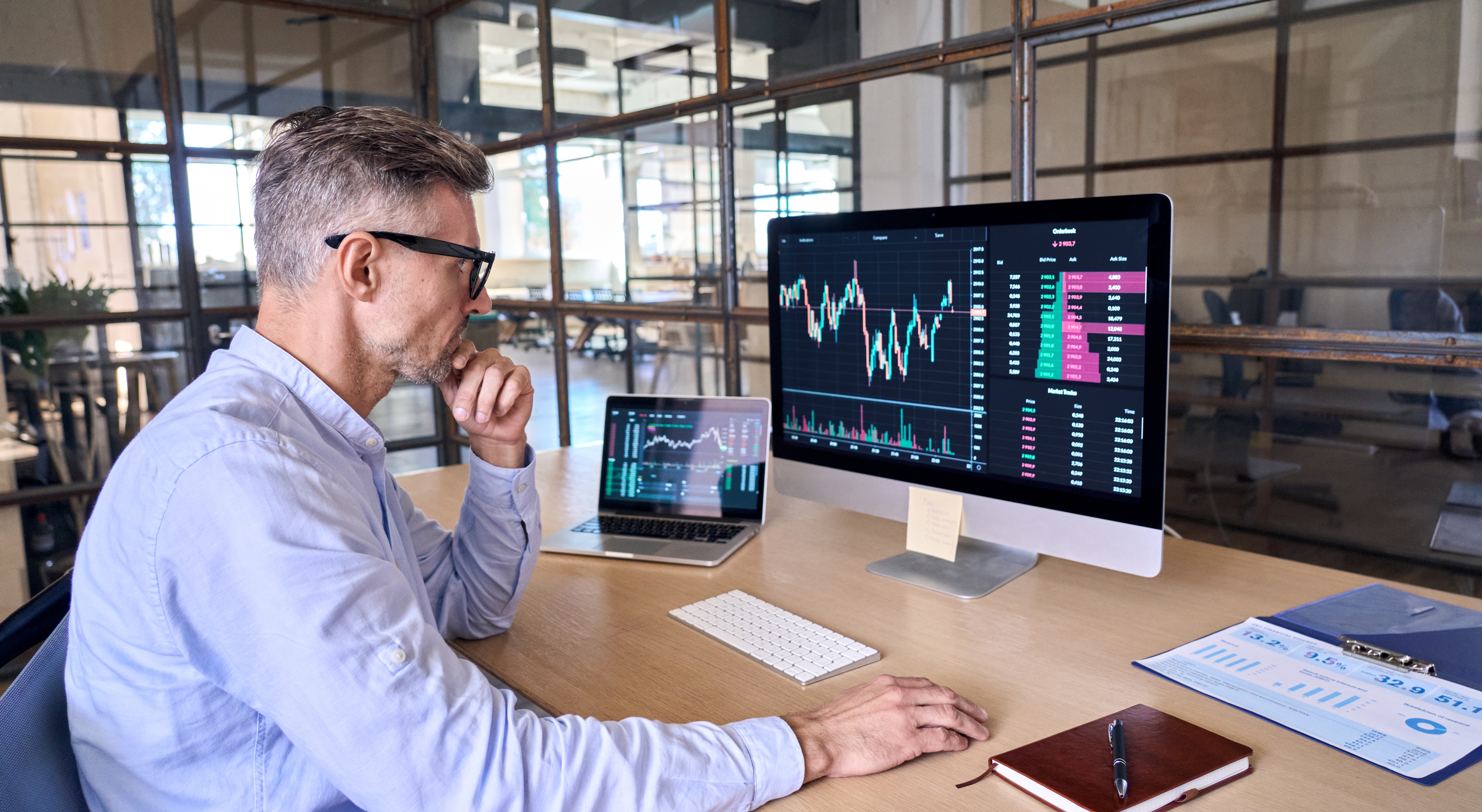 Man looking at graphs