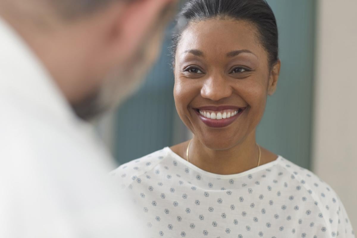 Patient smiles at doctor during an appointment